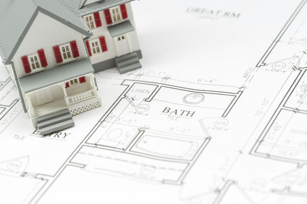 Model House Resting on Custom House Plans.