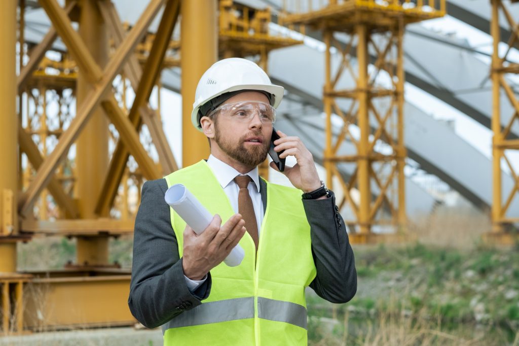 Architect talking on the phone outdoors